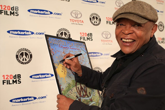 Hugh Masekela (A Snake Gives Birth to a Snake) signing in at 2014 Woodstock Film Festival. (Photo by Laura Revercomb)