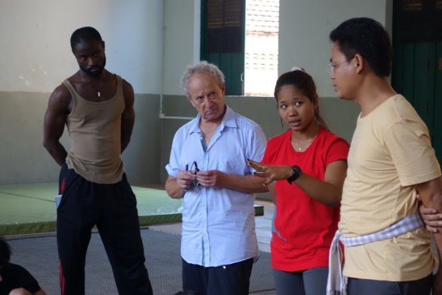 Phounam Pin (second from right) translates during a Global Arts Corps production development workshop at the Phare Ponleu Selpak in Battambang, Cambodia.
