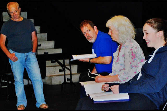 Director Michael Lessac and Hold Your Tongue, Hold Your Dead cast members Alan McKee, Julia Dearden, and Eileen O’Higgins in rehearsal at ArtsEmerson